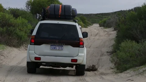 4x4 Vehicle driving over bumpy sand road Stock Footage 70716677