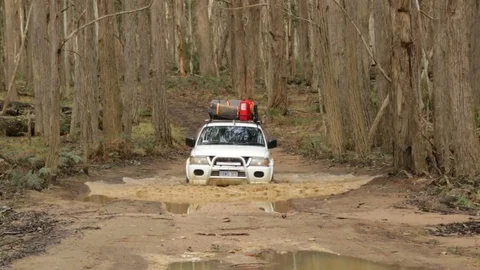 4x4 vehicle driving through deep water hole Stock Footage 71602939