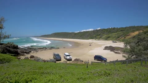 4x4 vehicles parked on beach at Double Island Point,Queensland,Australia Stock Footage 140590365