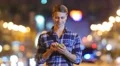 5 in 1 video! Man stand with phone and smile by city bokeh background 4k or 4k+ Resolution