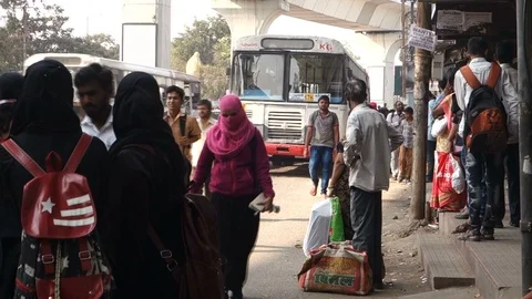 5-A-bus-arrives-at-a-bus-stop Stock Footage 89389568