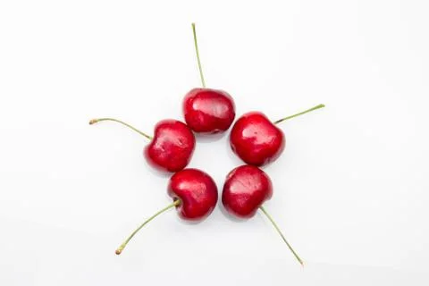 5 cherries on a white background. Stock Photos