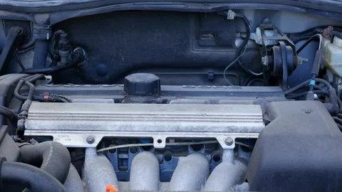 5 cylinder engine of old Volvo S70, motor running, sound Stock Footage 238530215