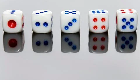 5 dices on the gray and reflexive table. 写真素材