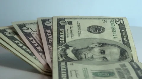 5 dollars in a circular motion Stock Footage 95594666