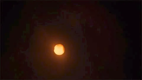 5% Eclipse with Cloud Cover. Stock Photos