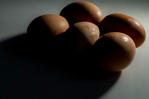 5 eggs low key Stock Photos