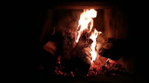 5 fires burn in the fireplace on a winter evening Stock Footage 168488500