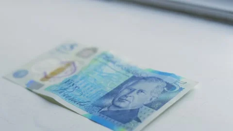 £5 Five Pounds Bank Note Put Down By Woman's Hand. Stock Footage 304510245