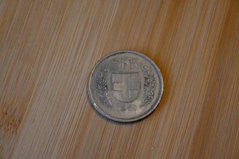 5 franc coin on table with copy space Stock Photos