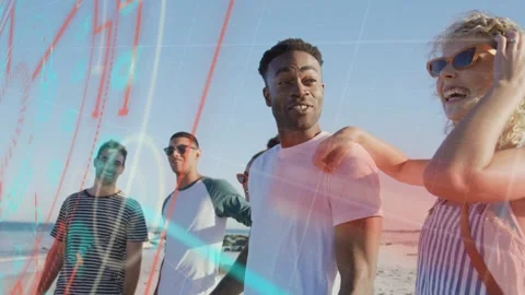 5 friends walking beach camera zooming woman linking arm laughing red blue lines Stock Footage 333657579