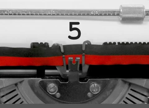 5 Number text written by an old typewriter on white sheet Фото