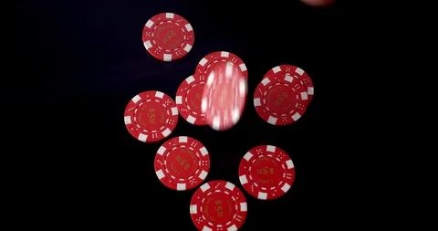 $5 red poker chips dropped onto black reflective background Stock Footage 112332286