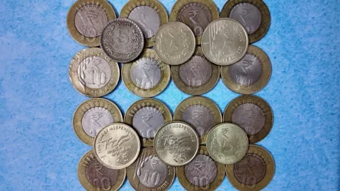 5 Rupee and 10 Rupee Indian Currency Coins - Slider Shot - Forwards Stock Footage 276721979