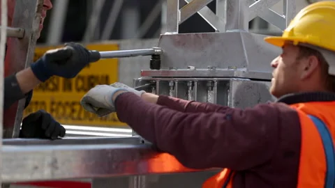 5 Team Of Workers Collaborating Working And Building Iron Infrastructure Stock Footage 131506971