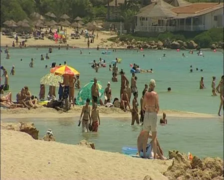 5 Tourists on the beach in southern Cyprus 16:9 PAL Stock Footage