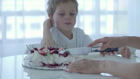 5 year old boy eats dessert at the white table Stock-Footage 92381502