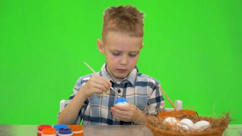 5 year old boy painting Easter eggs, chromakey Stock Footage 170694537