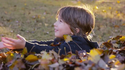 5 year old boy playfully reaches to someone off-screen 스톡 동영상 93887404