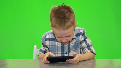 5 year old boy playing on smartphone, chroma key Stock Footage 170695317