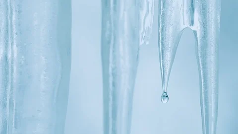 50 fps Close-up of melting transparent ice on a spring day Stock Footage 87626937