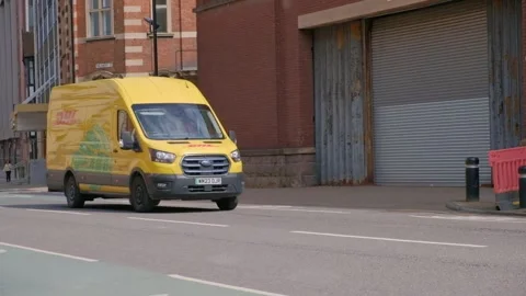 50 fps.DHL logistics delivery van in city center. Hull.UK 6.7.2024 Stock Footage 279805739
