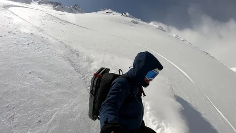 50% smooth slow motion. Extreme snowboarder rides fast backcountry powder Stock Footage 86561577