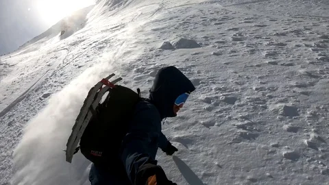 50% smooth slow motion. Extreme snowboarder rides fast backcountry powder Video stock 86563198