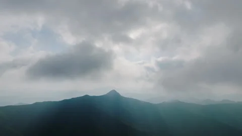 50.A view of clouds from the top of the mountain. Can you feel the close clouds? Stockbeeldmateriaal 303526513