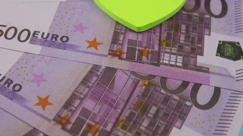 500 euro banknotes rotating on a table with multi-colored heart-shaped stickers Vídeo Stock 141927325