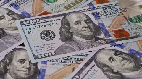 500 Indian rupee notes falling on one hundred US dollar banknotes Stock Footage 336663717