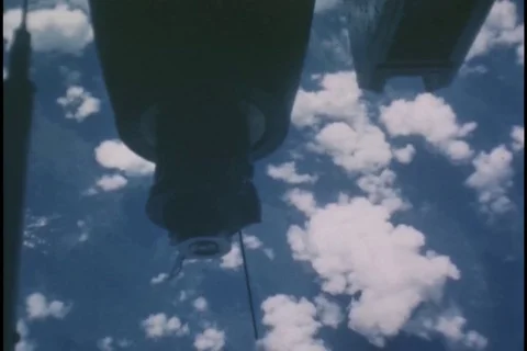 500 lb GP bombs being dropped from bomb bay of Boeing B-52 Stratofortress - 1968 Stock Footage 103751587