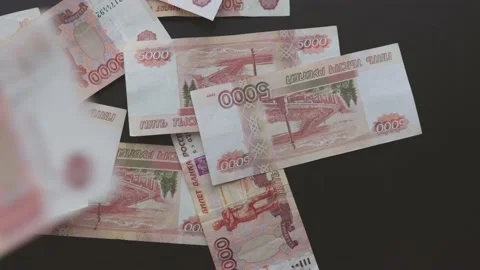 5000 rubles five thousand Russian rubles banknotes paper money falling on black Video stock 171374223