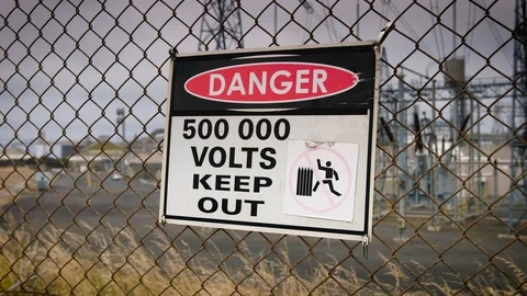 500,000 volt warning sign outside Australian aluminium smelter. Stock Footage 87644740