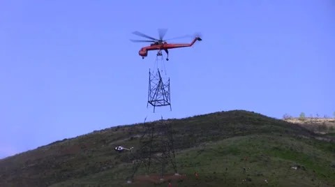 500kV Tower Construction Contruction Air Crane lowering piece Video stock 48001163