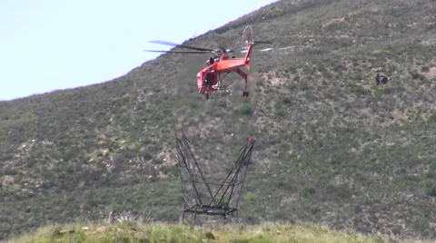 500kV Tower Construction Contruction Air Crane lowering piece Stock Footage 48002263