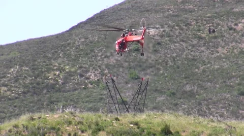 500kV Tower Construction Contruction Air Crane lowering piece Stock Footage 48002425