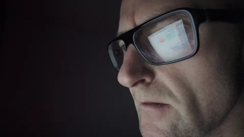 50fps. Man on computer. Dark room, screen reflection, glasses. Hull.UK. 1.1.2026 Stock Footage 327158672