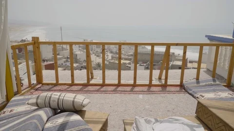 50fps Shot from a balcony overlooking a small surf town Taghazout Stock Footage 100243816