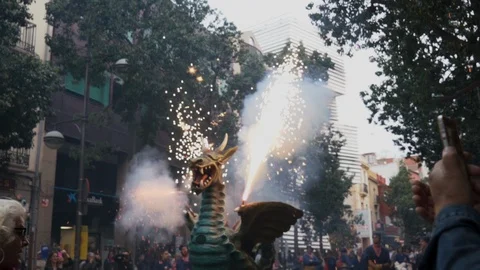 50Fps shot of Correfoc dragon spinning and throwing fireworks Stock Footage 100386516