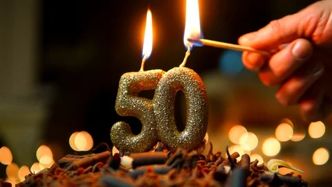 50th Birthday Cake Detail With Candles Burning, 4K Detail Stock Footage