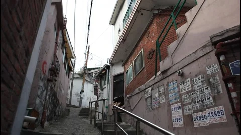 5112 Low Angle View of a Narrow Alley in a Disappearing Hillside Neighborhoo Stock Footage 338224744