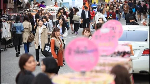 5118 Tilt Down from Crowded Hongdae Fashion Street to Fashion Accessories, Stock Footage 338224752