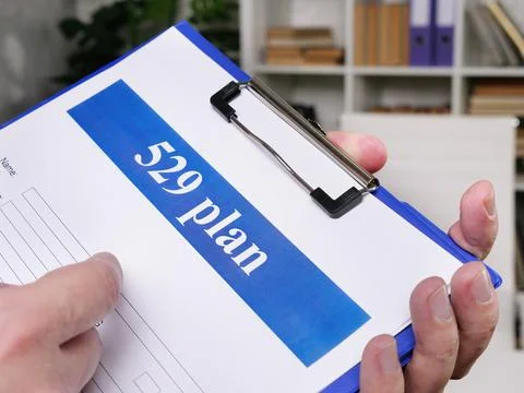 529 plan empty application in the hands. Saving for College concept. Stock Photos