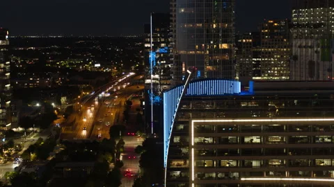 5.2k Evening Skyline Crane Down to Freeway Stock Footage 130180174