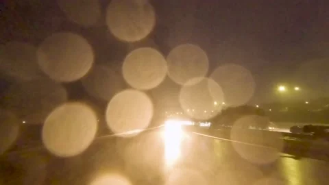 5.3K Driving Plate Rear View - city driving on expressway rain storm lightning Stock Footage 239342785