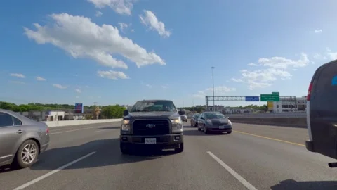 5.3K Driving Plate Rear View - driving down interstate heavy traffic craw Stock Footage 239544037