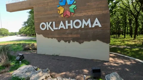 5.3K view of the Welcome To Oklahoma Sign With New Logo Design Stock Footage 243733492
