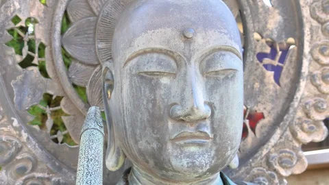 5567 The sleeping face on one of the buddha statues in Senso-ji Temple in Tok Stock Footage 121385749