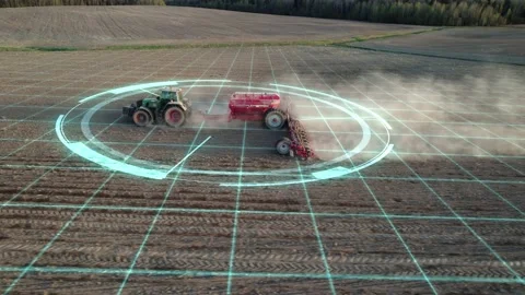 5G autonomous tractor without a driver working the soil before sowing. Future Stock Footage 194454391
